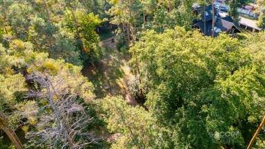 Prodej stavebního pozemku 1 300 m² se srubem, Stará Boleslav – Vestecká.